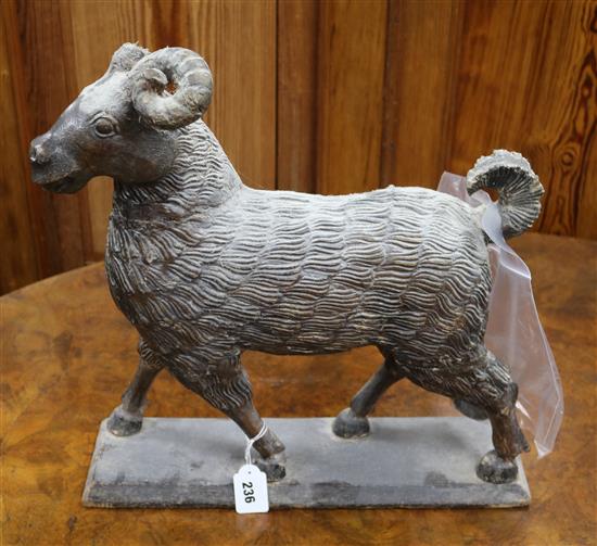 A carved wood goat